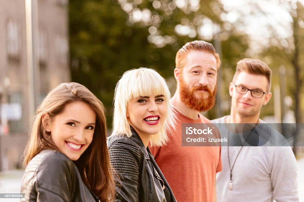 Outdoor portrait of happy friends Outdoor portrait of happy young people - two girls and two guys smiling at the camera. Close up of faces. 20-24 Years Stock Photo