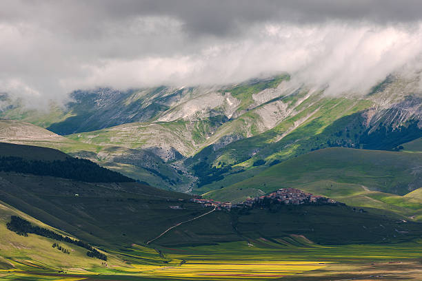 istock Castelluccio di Norcia (Italy), Village on a green hill 481780514