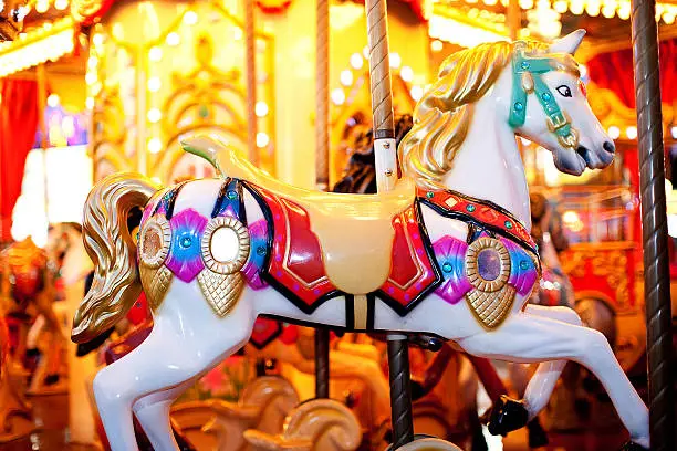 Photo of Night Shot of a Carousel´s White Horse