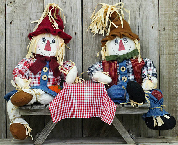 scarecrows сидя в кафе таблицы - child autumn scarecrow decoration стоковые фото и изображения