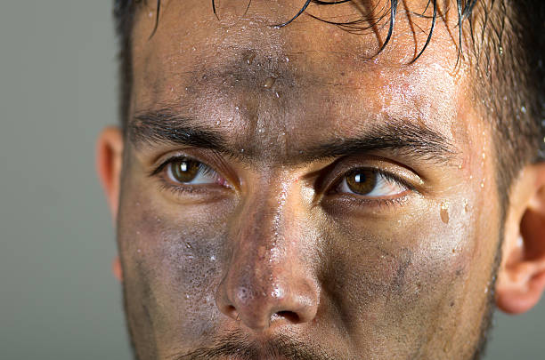 istock Closeup hispanic man dirty face eyes and nose caption looking 481793948