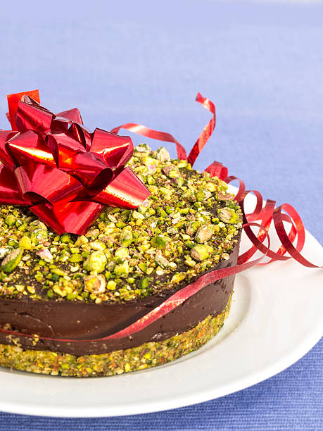 Raw pistachio chocolate cake stock photo