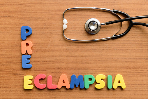 Pre-eclampsia  colorful word on the wooden background