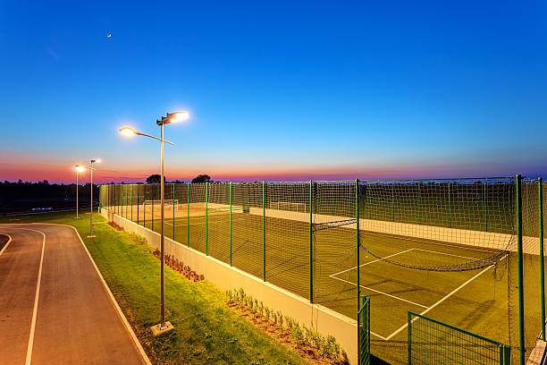 Small football pitch Small football pitch in sports center at night football field night american culture empty stock pictures, royalty-free photos & images