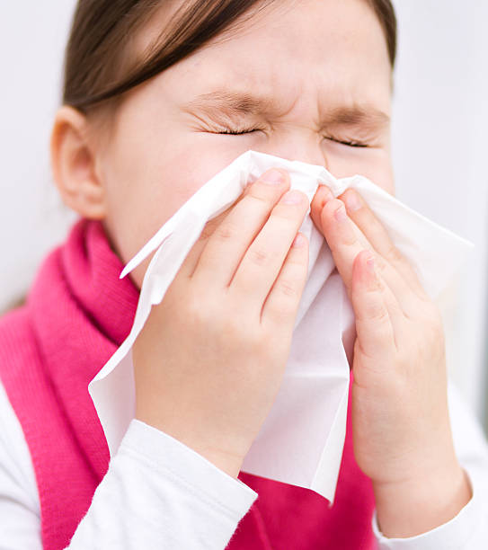 istock Girl is blowing her nose 481797477