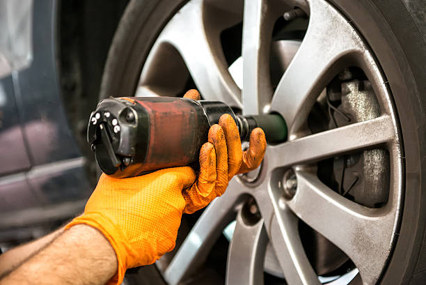 istock Mechanic working on a car wheel 481810698