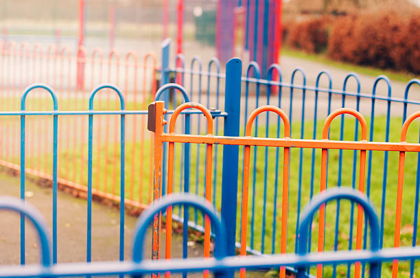istock Colorful fences on playground, England 481817636