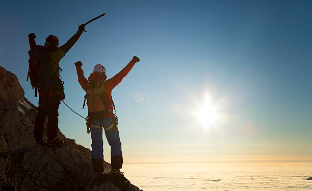 istock Climbers standing on rock and celebrating 481821424