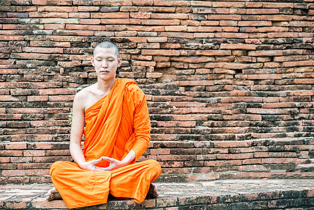 istock Thai monk meditation at temple in Ayutthaya, Thailand 481822270