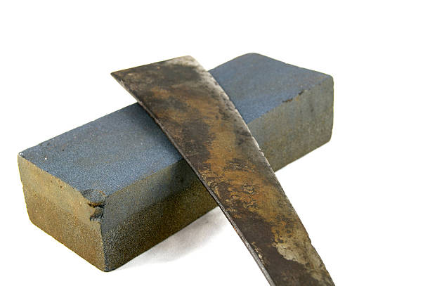 istock Sharpening or honing a knife on waterstone 481825183
