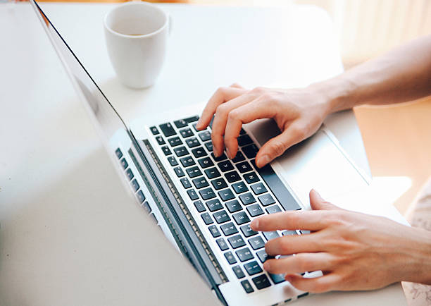istock typing on a laptop keyboard 481825750