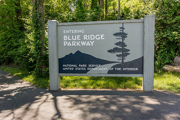 Blue Ridge Parkway Sign A popular road trip destination, the Blue Ridge Parkway is full of motorcyclists, bicyclists, and motorists during spring, summer, and fall blue ridge parkway stock pictures, royalty-free photos & images