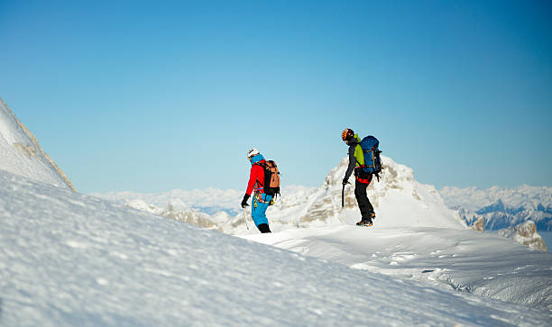 istock Men hiking on snow covered landscape 481826664
