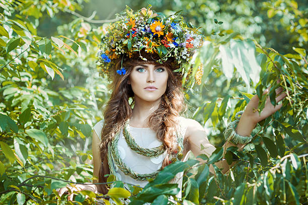 istock Girl among leaves trees with a wreath on his head. 481827162