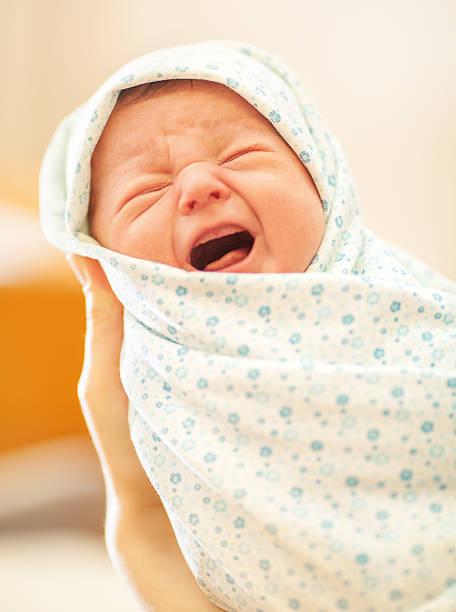 istock Crying newborn in mothers hands 481830744