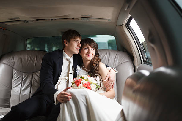 istock Bride and groom in a car 481830780