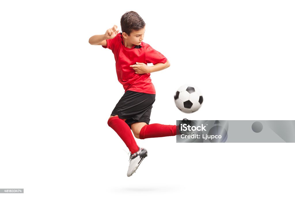 Junior Fußball-Spieler einen trick durchführen - Lizenzfrei Kind Stock-Foto