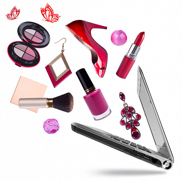 Opening laptop pc with cosmetic products flying out on white Opening laptop pc with cosmetic products flying out on white black and red butterfly stock pictures, royalty-free photos & images