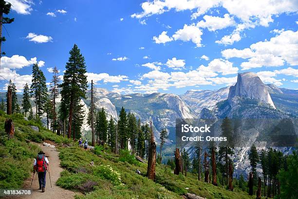People Hikers Hiking In Yosemite National Park On Sunny Day Stock Photo - Download Image Now