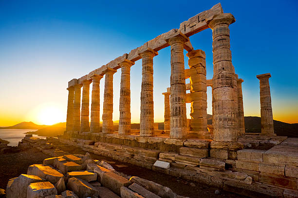 Temple of Poseidon at Cape Sounion, Greece Greece. Cape Sounion - Ruins of an ancient Greek temple of Poseidon before sunset ancient greece stock pictures, royalty-free photos & images