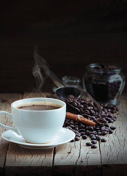 istock hot coffee and beans on wood background 481838046