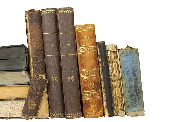 istock Front view of old books stacked on a shelf. 481841434