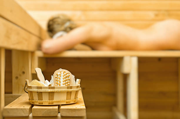 istock Spa accessories in sauna. Woman on background. 481841724
