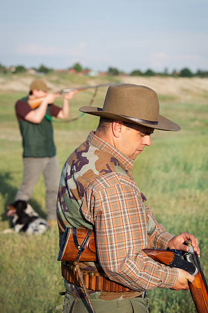 Man Loading Rifle 320+ Man Loading A Shotgun Stock Photos, Pictures & Royalty-Free Images ...