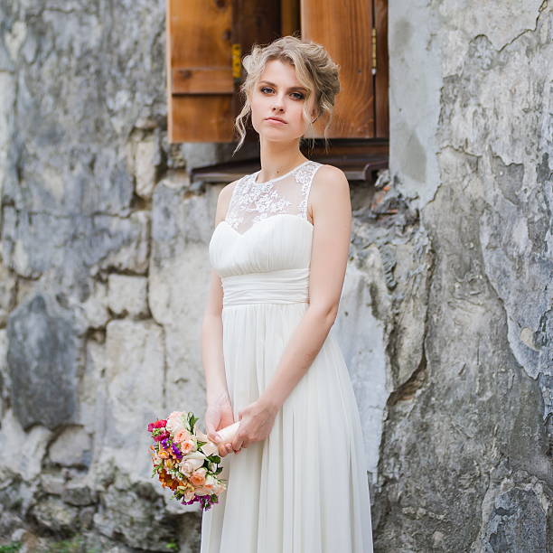istock Bride with big wedding bouquet before ceremony 481842388