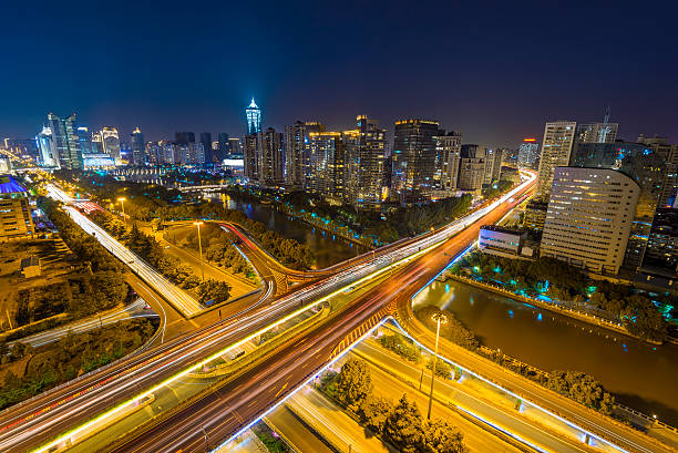 istock traffic light trails on overpass and cityscape at night 481843480