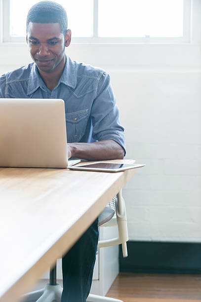 istock African American man working on a laptop computer. 481844648