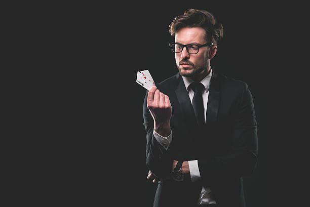 istock Male gambler with aces 481845036