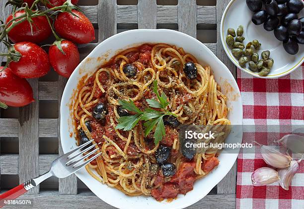 Italian Food Pasta Alla Puttanesca With Tomatoes Olivescapers Stock Photo - Download Image Now