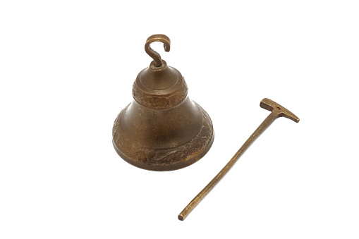 a metal bell with a hammer isolated on white background