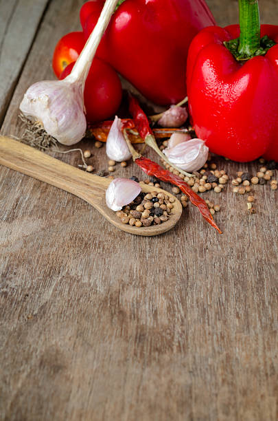 Powder spices on spoons in black wooden table background