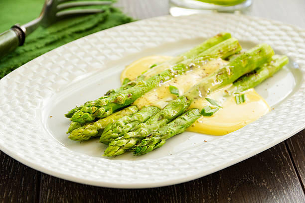 Grilled asparagus with hollandaise sauce. Grilled asparagus with hollandaise sauce. hollandaise sauce stock pictures, royalty-free photos & images