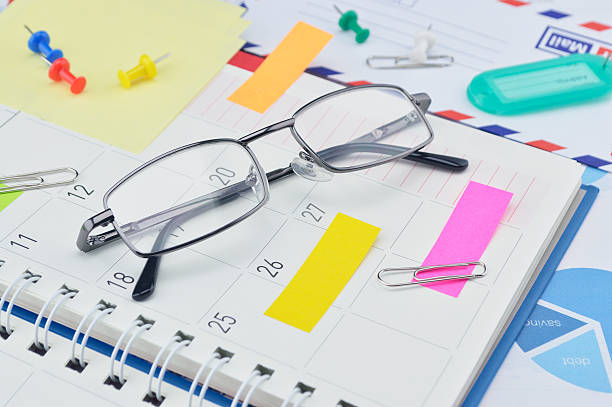 istock Glasses with notes and pin on business diary page 481853902