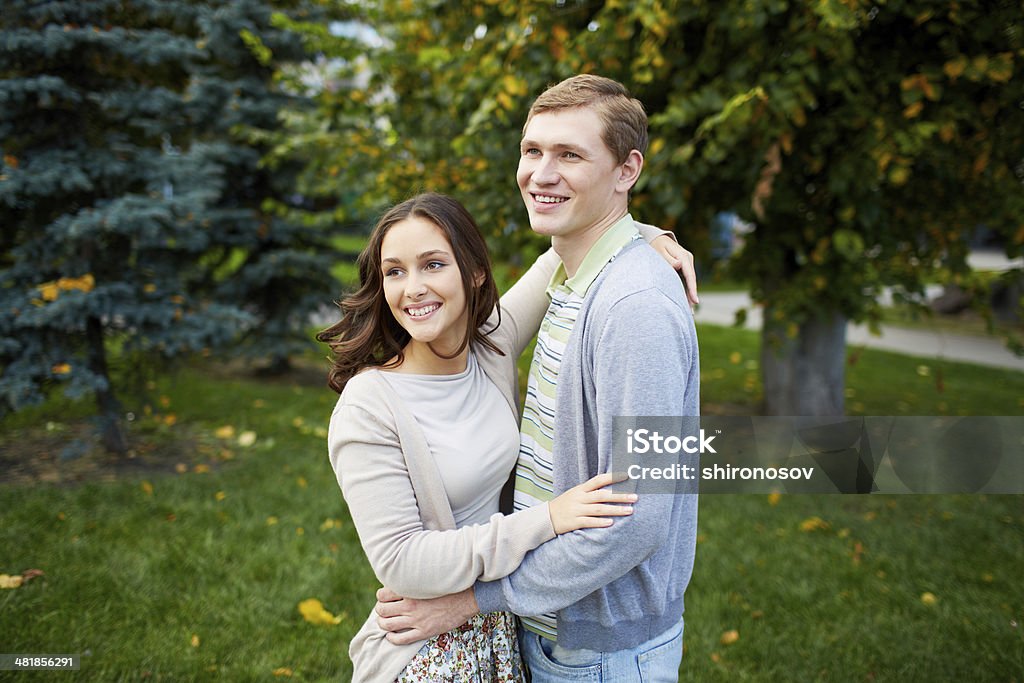 Happiness Happy girl and her boyfriend having walk in park Adult Stock Photo