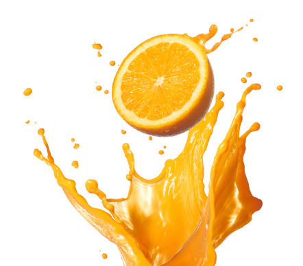 orange juice splashing with its fruit isolated on white