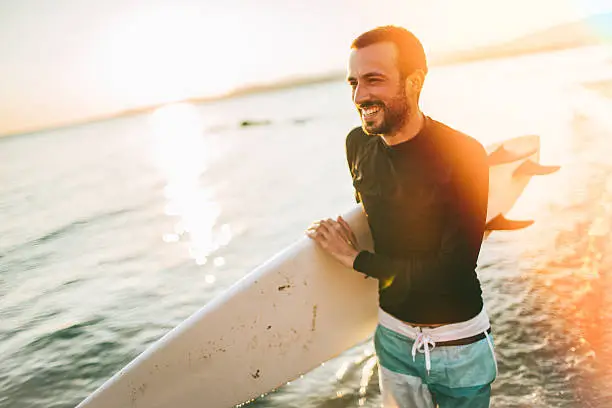 Portrait of a surfer's joy after seeing a good wave on a horizon