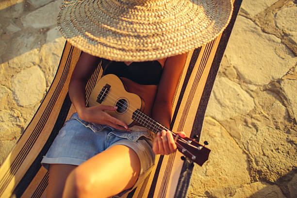 istock Lovely musician in the hammock 481858632