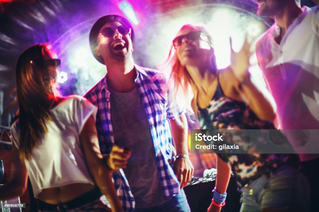 People dancing at a party. Shoot production Ref#70 -Music Concert- This submission was created with Shoot Production Tool feedback. Party - Social Event Stock Photo