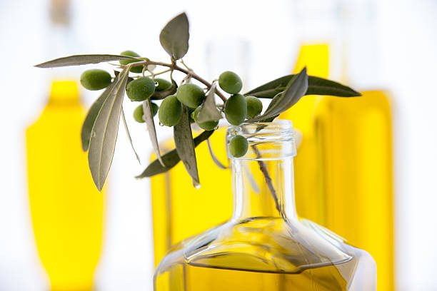 istock olive oil bottles on white background 481859018