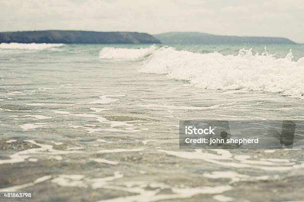 Waves Rolling In At Perranporth Beach Stock Photo - Download Image Now - 2015, Beach, Blue