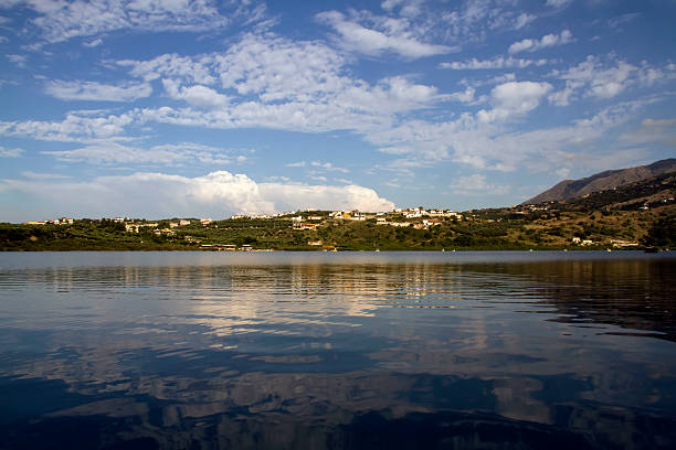 Lake Kournas Crete's (Greece, Europe) only freshwater lake. Around the lake reflected the White Mountains in the mirror-like waters. lefka ori photos stock pictures, royalty-free photos & images