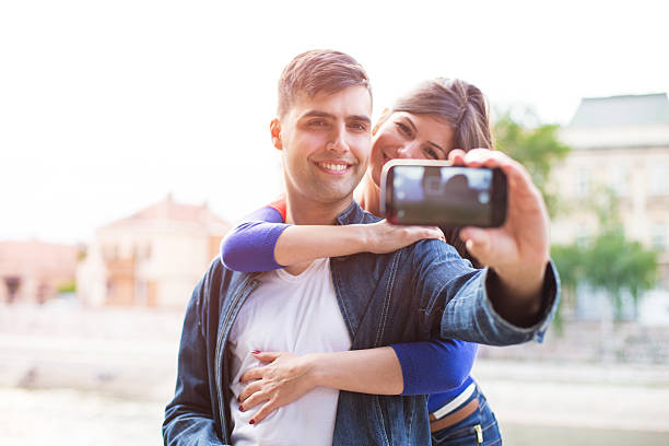 istock Dating Couple Having Fun with Smartphone Photography 481865452