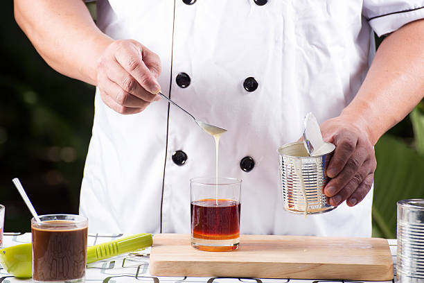 istock Pouring Milk to Tea 481866534
