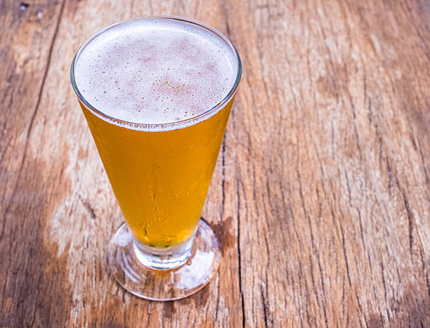 istock Closeup beer glass on wood background 481869740