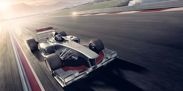 carreras de automóviles al atardecer - motor racing track sports race car motorized sport fotografías e imágenes de stock
