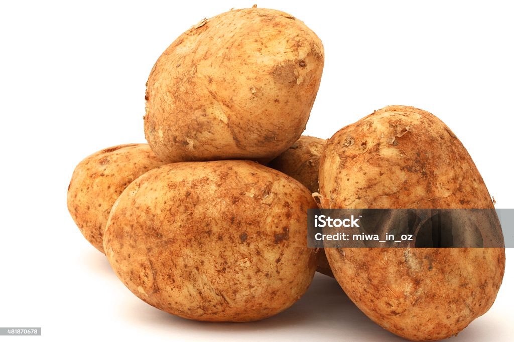 Brushed Potato Fresh brushed potatoes on white background. 2015 Stock Photo